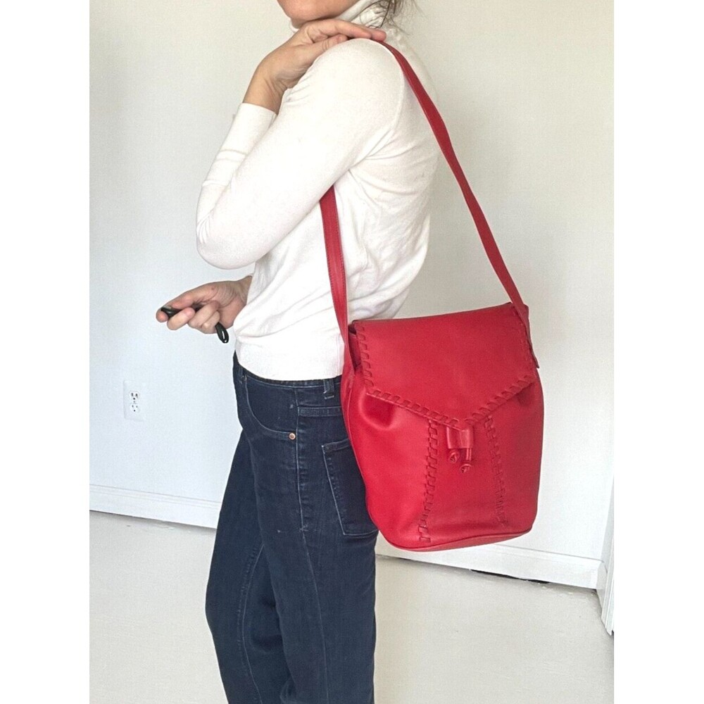 Stunning Yves Saint Laurent red handbag from the greatest designer of all time